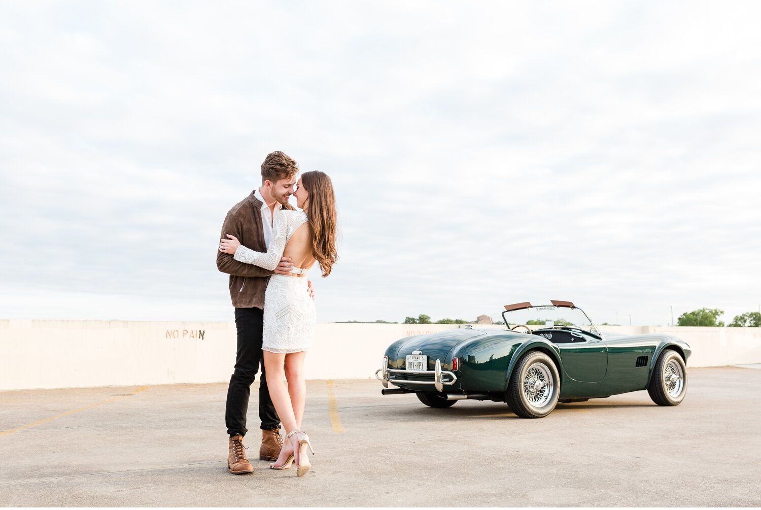 London + Christian Downtown Austin Rooftop Classic Car Engagement Session_0019.jpg