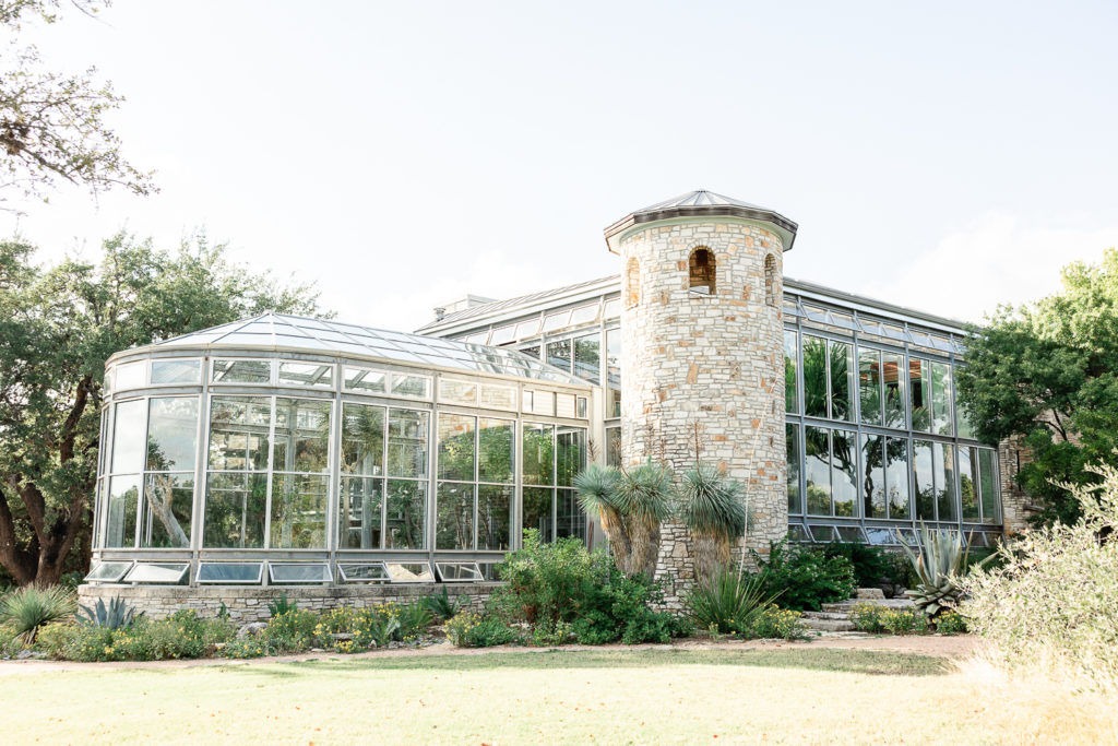 An exterior photo of the greenhouse at the greenhouse at driftwood, one of the best austin wedding venues. 