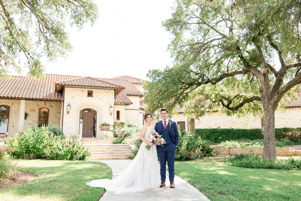 A bride and groom portrait at the Garey House, one of the best austin wedding venues. 