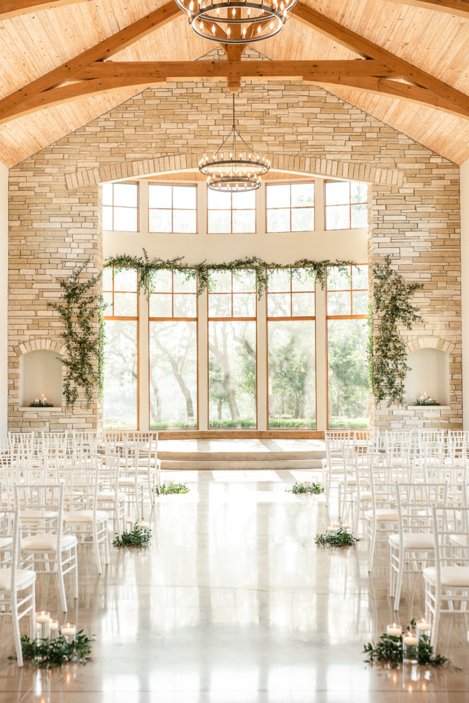 An indoor ceremony set up at Canyonwood Ridge, one of the best austin wedding venues. 