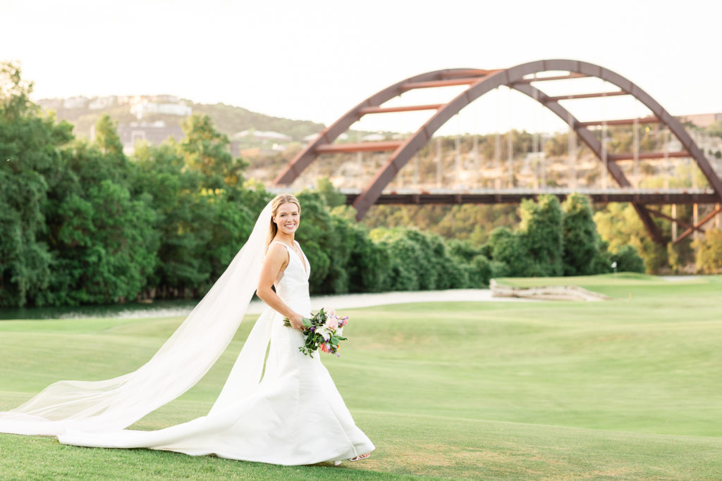 A sunset portrait of a bride at Austin Country Club, one of the top austin wedding venues.