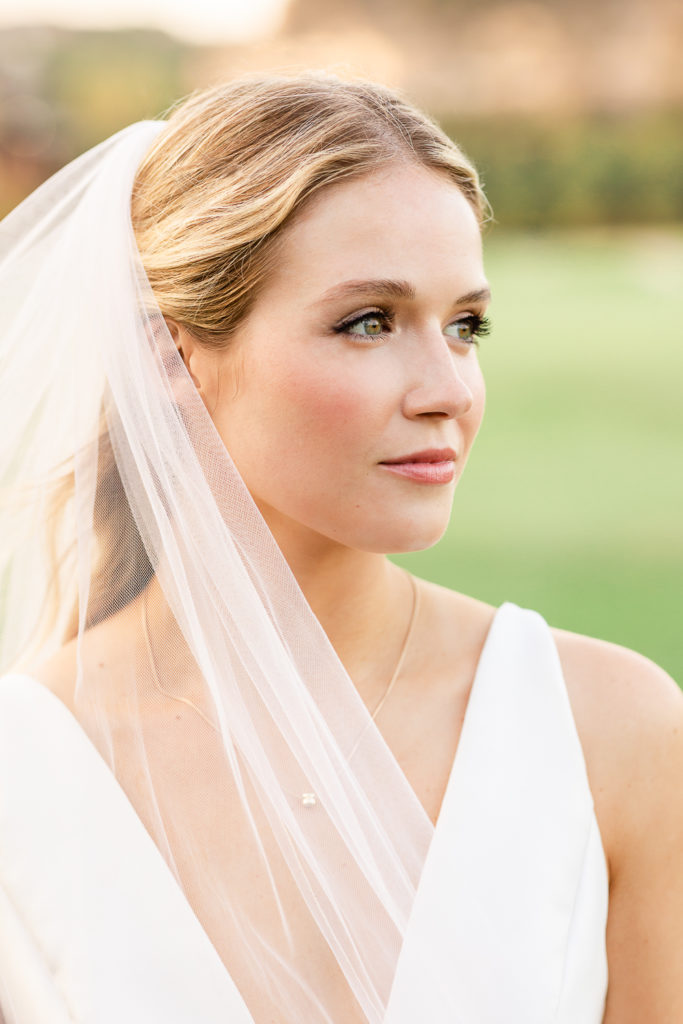 A sunset portrait of a bride at Austin Country Club, one of the top austin wedding venues.