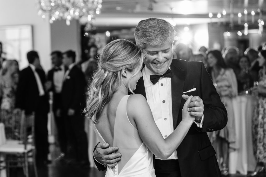 a black and white photo of a bride and her dad dancing at Westwood Country Club, one of the top austin wedding venues. 