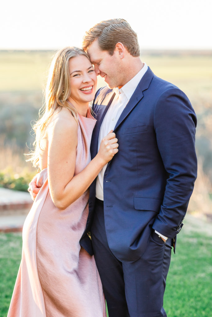 engagement photo outfits couple wearing pink dress and blue suit